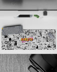 Crisp black-and-white anime panel mouse pad with bright orange pop and nostalgic shonen energy, 32x12 inches.