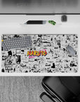 Crisp black-and-white manga panels with a pop of orange, nostalgic shonen mouse pad 32x16 inches.
