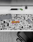 36x16 inches anime desk pad in crisp black and white with a bright orange pop, energetic shonen vibe.