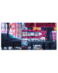 Mouse pad featuring Neon Sakura Nights, 32x16 inches, with modern city lights and cherry blossoms, evoking a beautiful blend of tradition and neon.