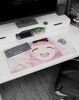 32x16 inches anime desk mat featuring a pink-haired girl with cheeks squished into a big grin.