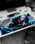 Anime desk pad 40x20 inches showing a hooded armored warrior reaching out, pulling blue power from the air.