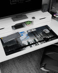 36x16 inches anime desk pad showing two helmeted figures in dark coats on a rain-gloss street, map in hand.