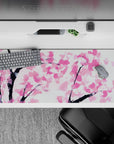 Striking 36x16 desk pad highlights soft pink petals with intricate details for a serene artistic touch