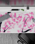 Tranquil 40x20 desk pad showcases delicate sakura blooms on a calming canvas for peaceful workspace vibes