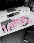 Delicate artwork on 36x16 desk mat captures the tranquil essence of cherry blossoms in stunning simplicity
