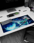 Silver-haired anime swordswoman under a full moon, water-like blade trail on a 36x16 inches desk pad.
