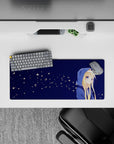 28x12 inches desk mouse pad in soft midnight blues with calm firefly-like flower specks, cozy vibe.