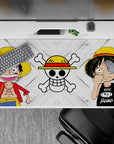 Dual-design 40x20 desk pad showcases Luffy's iconic looks with bright smile and signature hat for fans