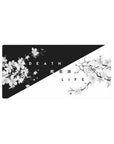 Mouse pad featuring Duality Blossom, 32x16 inches, with cherry blossoms against bold black-and-white tones, symbolizing the cycle of life and death.