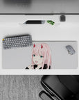 Intense 32x12 mouse pad features Zero Two’s iconic grin and teal eyes with intricate details for fans of bold artistry