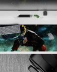 36x16 inches desk pad with Naruto Uzumaki in battle stance, perfect for fans of bold, vibrant anime designs.