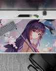 Pastel spring romance desk pad 40x20 inches in pink and violet tones with rain droplets and soft glow.
