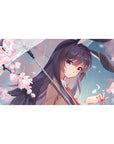 Anime girl desk pad 40x20 inches with sakura petals, glossy umbrella line art, and bunny ears detail.