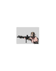 Classic anime girl mouse pad 14x10 inches with tan cap, chunky headset, and sleek black rifle on pale backdrop.