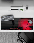32x12 inches anime mouse pad in smoky blacks and deep grays with a moody red sun glow over water.