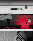 36x16 inches anime desk pad in smoky blacks and deep grays, crimson glow reflection, moody night vibe.