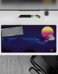 Dynamic 32x16 desk mat combines neon stripes and deep blue tones for impactful tropical visuals