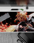40x20 inches desk pad showcasing Kyōjurō Rengoku, with powerful flame techniques and vibrant colors that reflect his determination to protect.