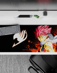 36x16 inches anime desk pad in deep black with orange splatter flames, intense fiery battle mood.