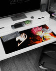 36x16 inches desk pad showing Natsu Dragneel pink spiked hair, battle marks, arm glowing with heat.