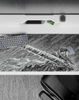 Sleek 36x16 inch desk pad featuring Guts' iconic intensity in raw sketch-style art for anime enthusiasts