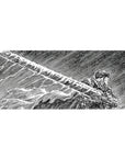 36x16 inch desk pad highlighting Guts in a striking black-and-white manga panel with the Dragonslayer