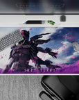 Moody sci-fi anime desk pad 40x20 inches, black graphite tones with electric magenta and sky-blue glow.
