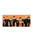 Karasuno volleyball squad silhouette anime mouse pad, bold lineup on orange backdrop, 28x12 inches.