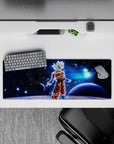 32x12 inches mouse pad featuring Goku in Ultra Instinct, with cosmic power and serene energy, perfect for fans of Dragon Ball Z.