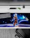 36x16 inches desk pad with Goku in Ultra Instinct, capturing his serene power in a cosmic environment, ideal for any Dragon Ball fan.