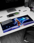 Artistic 36x16 inches desk pad with Goku in Ultra Instinct, featuring cosmic energy and his ultimate form for an energetic and serene workspace.