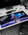 Large 40x20 inches desk pad featuring Goku in Ultra Instinct, standing in a cosmic backdrop, representing his unmatched power and serenity.