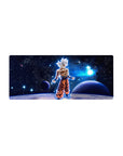 Mouse pad featuring Goku in Ultra Instinct, 28x12 inches, with cosmic energy surrounding him, perfect for adding power to your desk.