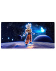 Mouse pad featuring Goku in Ultra Instinct, 32x16 inches, surrounded by cosmic energy, perfect for adding universal power to your desk.