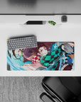 Compact yet detailed 28x12 inch mouse pad showcasing Tanjiro and Nezuko's intense action and energy