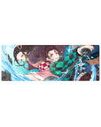 32x12 inch mouse pad featuring Tanjiro and Nezuko in intense action with powerful water techniques