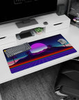 Modern 32x16 inches mouse pad featuring Neon Oasis Dusk, with palm trees against a serene, retro-futuristic sunset of violet and pink colors.