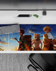 36x16 inches desk pad featuring a golden sunset with three brave warriors from Demon Slayer, ideal for adding heart and adventure to your desk.