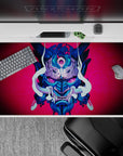 Dynamic 40x20 inch desk pad showcasing an intense Oni mask, perfect for fans of chaotic and striking art