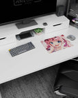 Pink-haired, blue-eyed anime girl smiling amid drifting sakura petals on a 14x10 inches mouse pad.