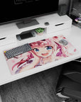 32x16 inches desk mat showing a bubbly pink-haired anime girl with heart highlights in her sky-blue eyes.
