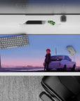 Dreamy gradient anime desk pad 36x16 inches in blue-to-peach sunset tones with wet street glow.