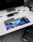 High-energy 28x12 mouse pad showcasing Unit-01 and an Angel locked in combat with neon purples, electric greens, and fiery reds