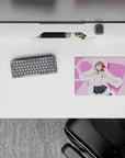Cute pink heart background anime mouse pad 14x10 inches, cozy cheerful vibe with cream vest and blue plaid skirt.