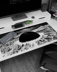 40x20 inches anime desk pad showing a halo blast ring above ruined towers under a stark black sun.