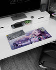 28x12 inches desk mat showing starry-eyed lilac-haired anime girl in crystal armor amid drifting petals.