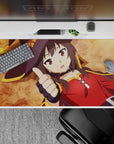 Megumin from KonoSuba on 40x20 inch anime mouse pad, lying thumbs up on ochre background with crimson cloak and witch hat.
