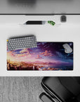 Magical 28x12 mouse pad featuring waterfalls, mountains, and a starry night sky transitioning from a stunning sunset for a serene workspace