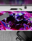 40x20 inches desk pad showcasing Tanjiro Kamado in action, igniting his sword with fiery energy and vibrant reds and purples for an intense design.
